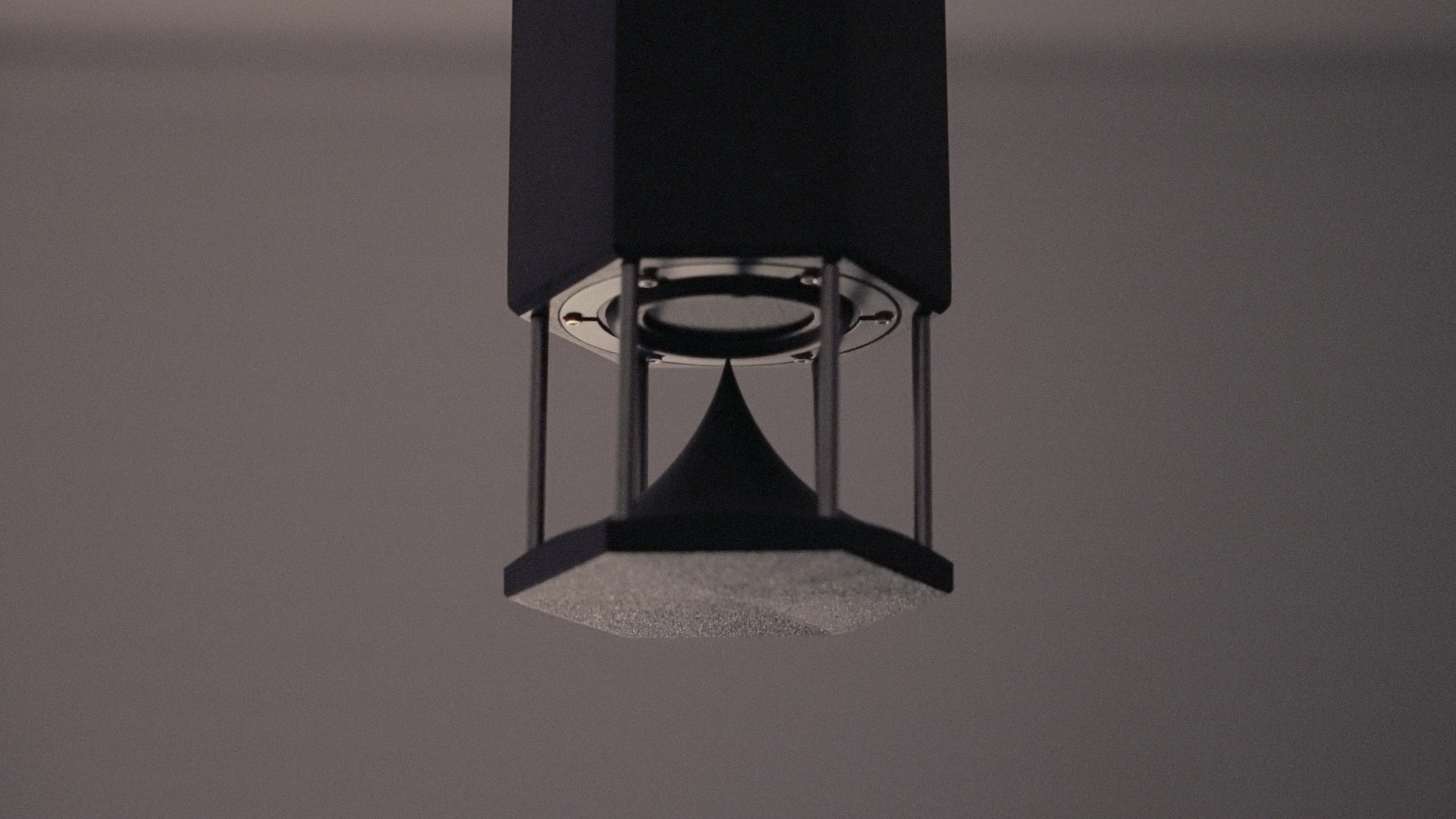Detail of the custom Omni pendant speaker, showing its stainless steel housing and omni-directional driver.
