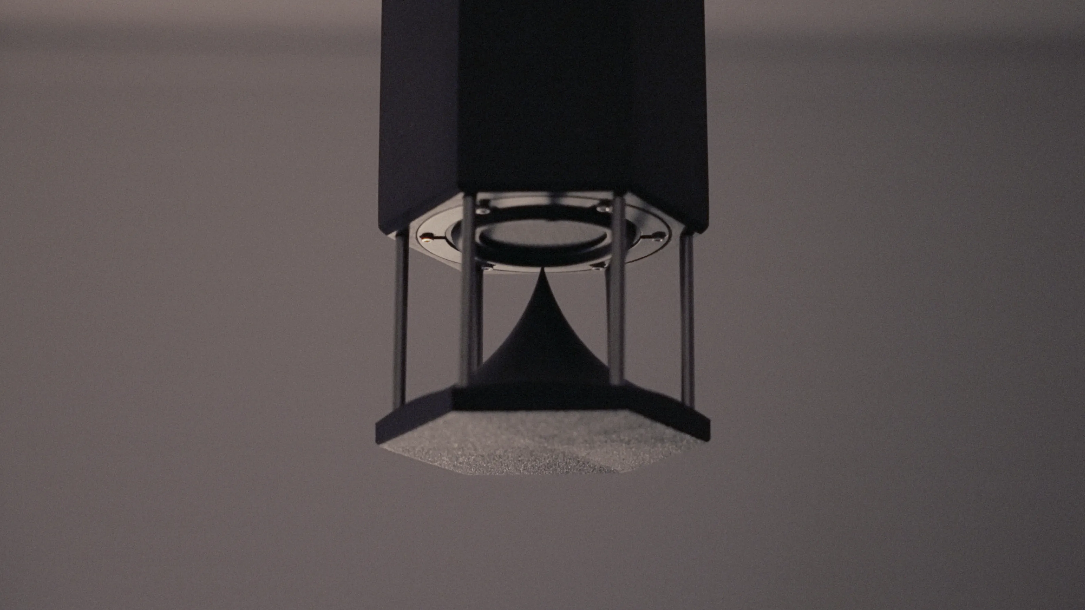 Detail of the custom Omni pendant speaker, showing its stainless steel housing and omni-directional driver.